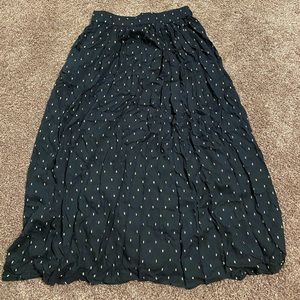 Large black skirt with gold accents by Carmen Marc Valvo